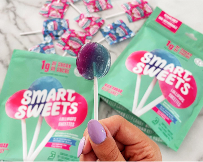 Holding Lollipop and Lollipop pouches