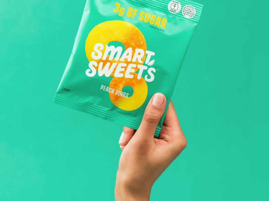 Holding Peach Rings pouch