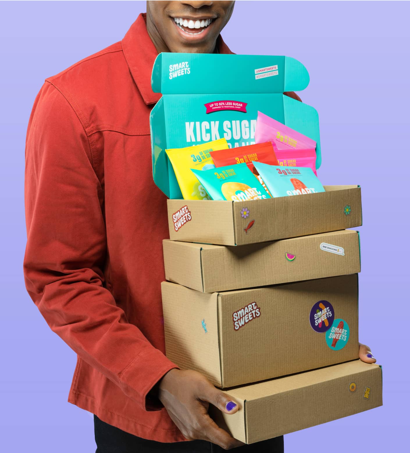 Man holding SmartSweets cardboard boxes