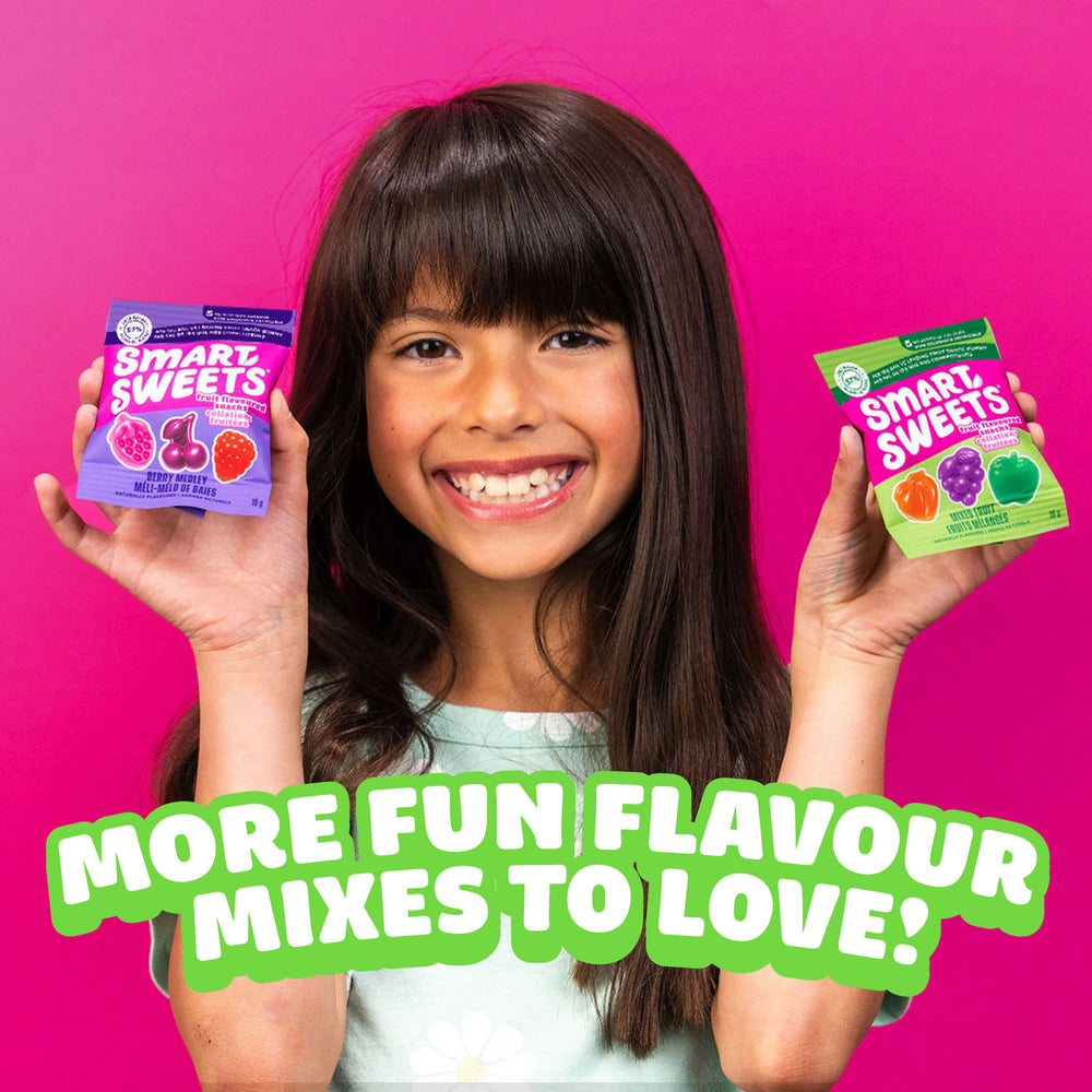 Girl holding two candy bags with text: MORE FUN FLAVOUR MIXES TO LOVE!