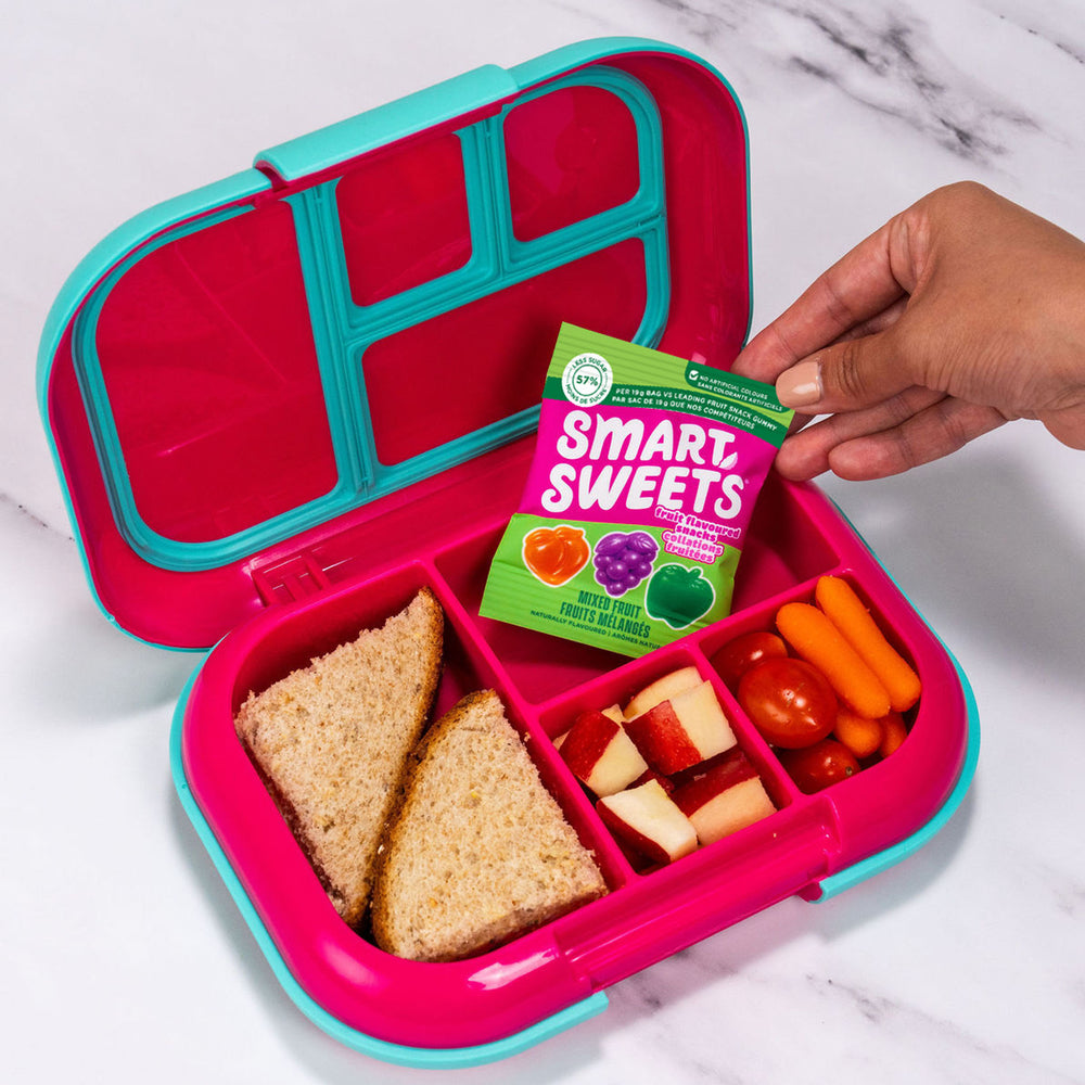 Lunch box with a sandwich, carrots, and a snack pack reading MIXED FRUIT.