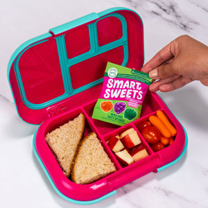 Lunch box with a sandwich, carrots, and a snack pack reading MIXED FRUIT.