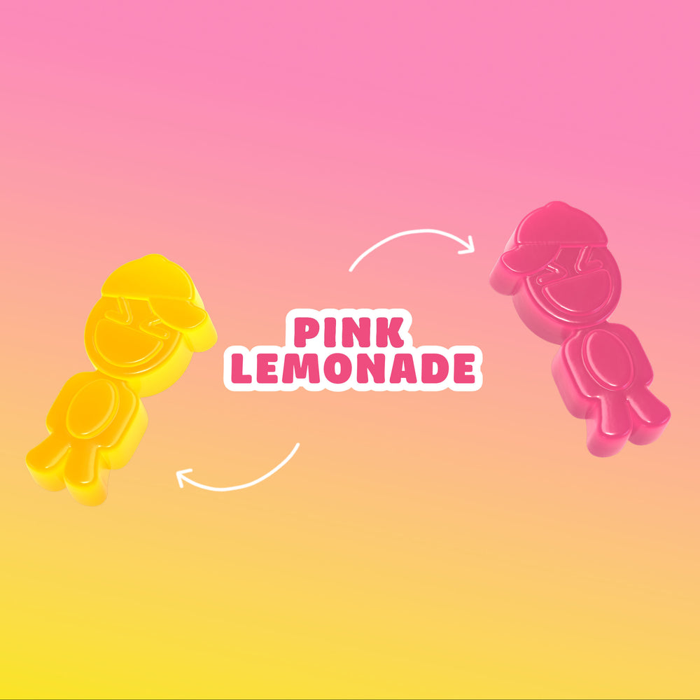 Two colorful gummy candies shaped like smiling characters with caps, one yellow and one pink, against a gradient pink and yellow background with the text Pink Lemonade Buddies.
